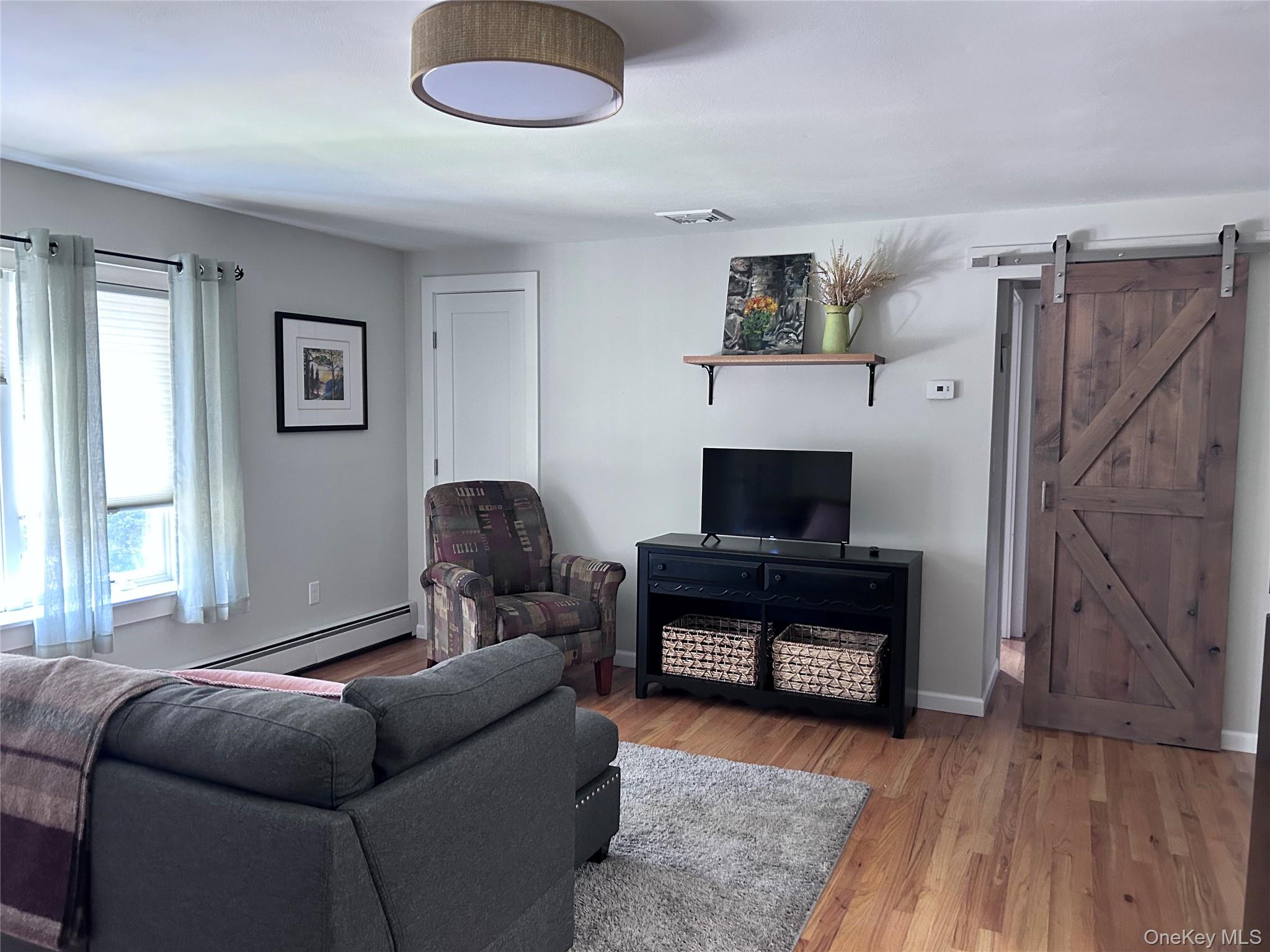 58 Wheaton Avenue Fishkill, NY 12524 - Photo 19 of 20 a living room with furniture and a fireplace