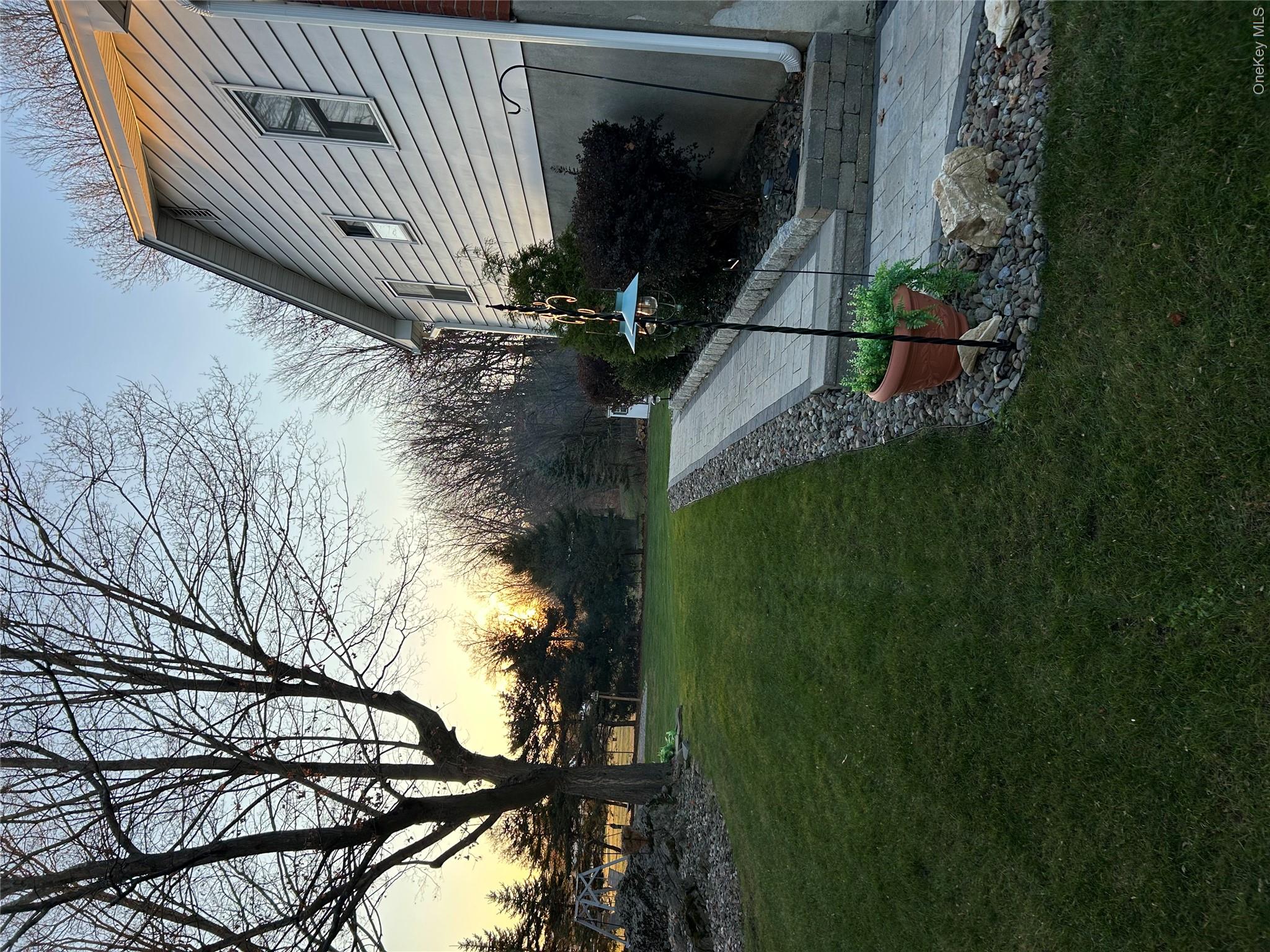 58 Wheaton Avenue Fishkill, NY 12524 - Photo 3 of 20 a view of a garden with a bench in a garden
