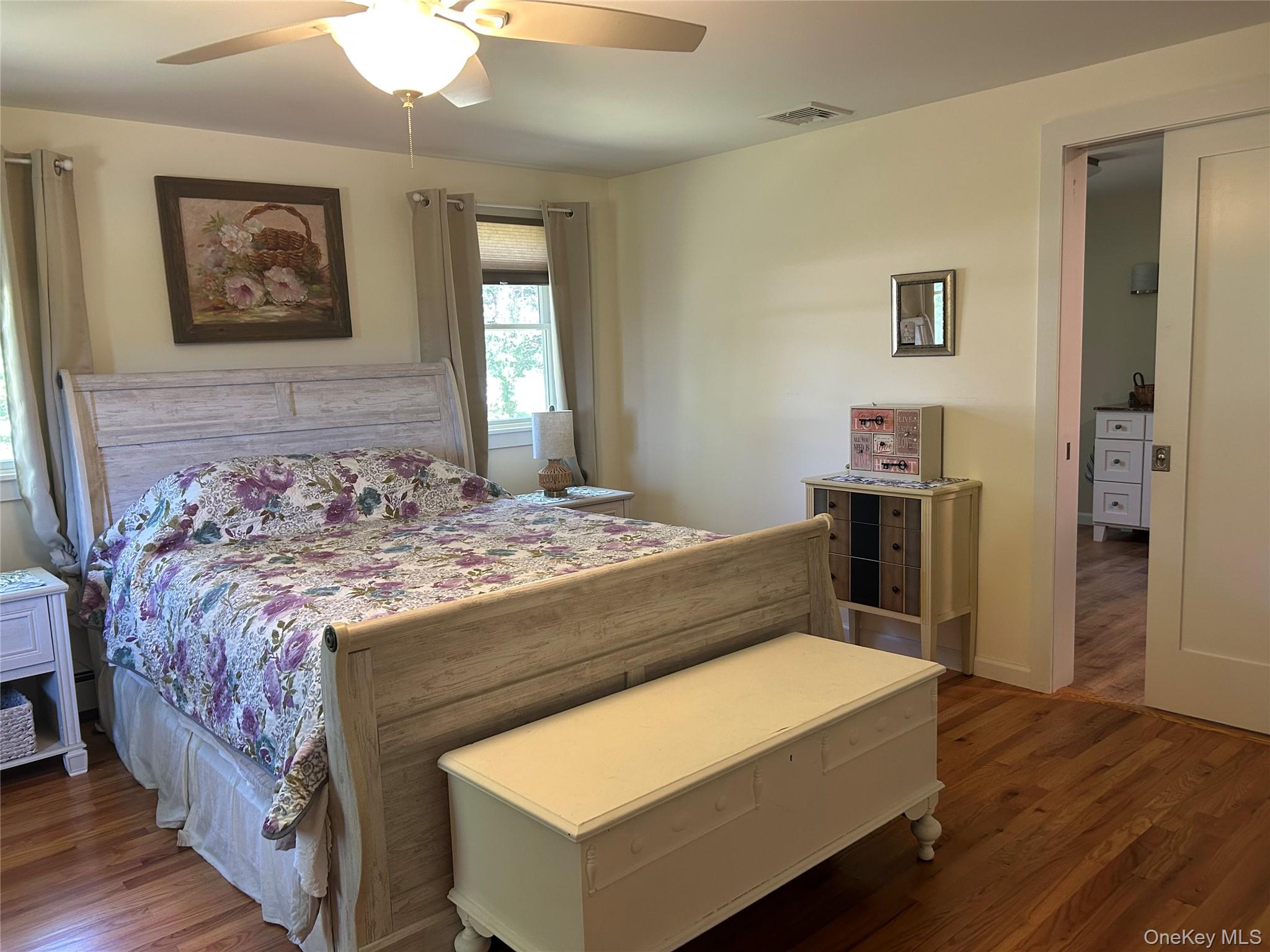 58 Wheaton Avenue Fishkill, NY 12524 - Photo 8 of 20 a bedroom with a bed and a table in it