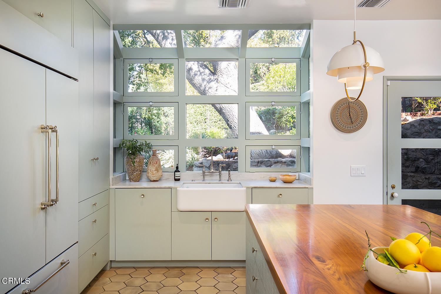 490 La Loma Road Pasadena, CA 91105 - Photo 21 of 59 a room with kitchen island a large window a sink and a stove