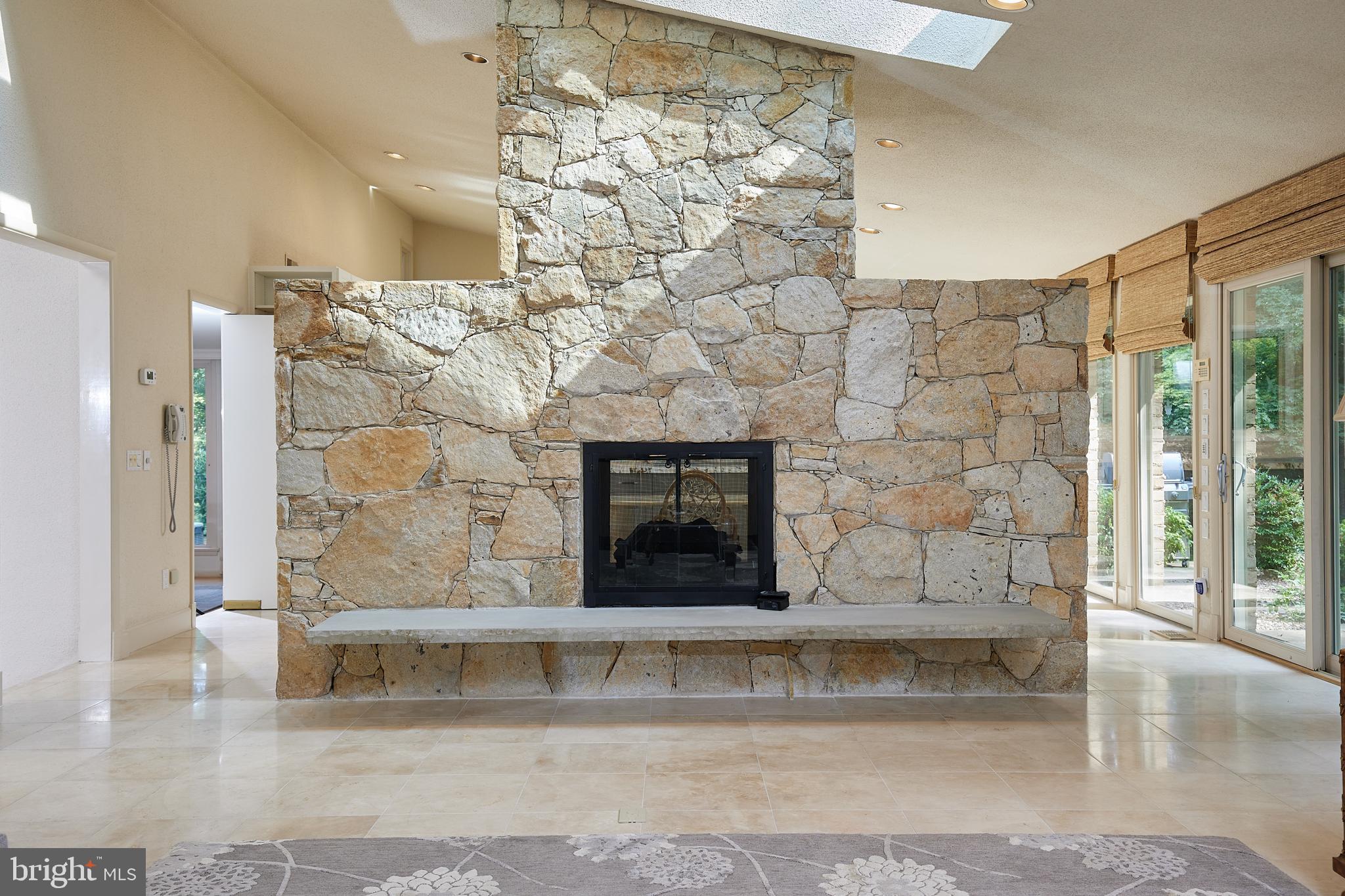 10811 Barn Wood Lane Potomac, MD 20854 - Photo 12 of 41 Floor to Ceiling Double Sided Gas Fireplace