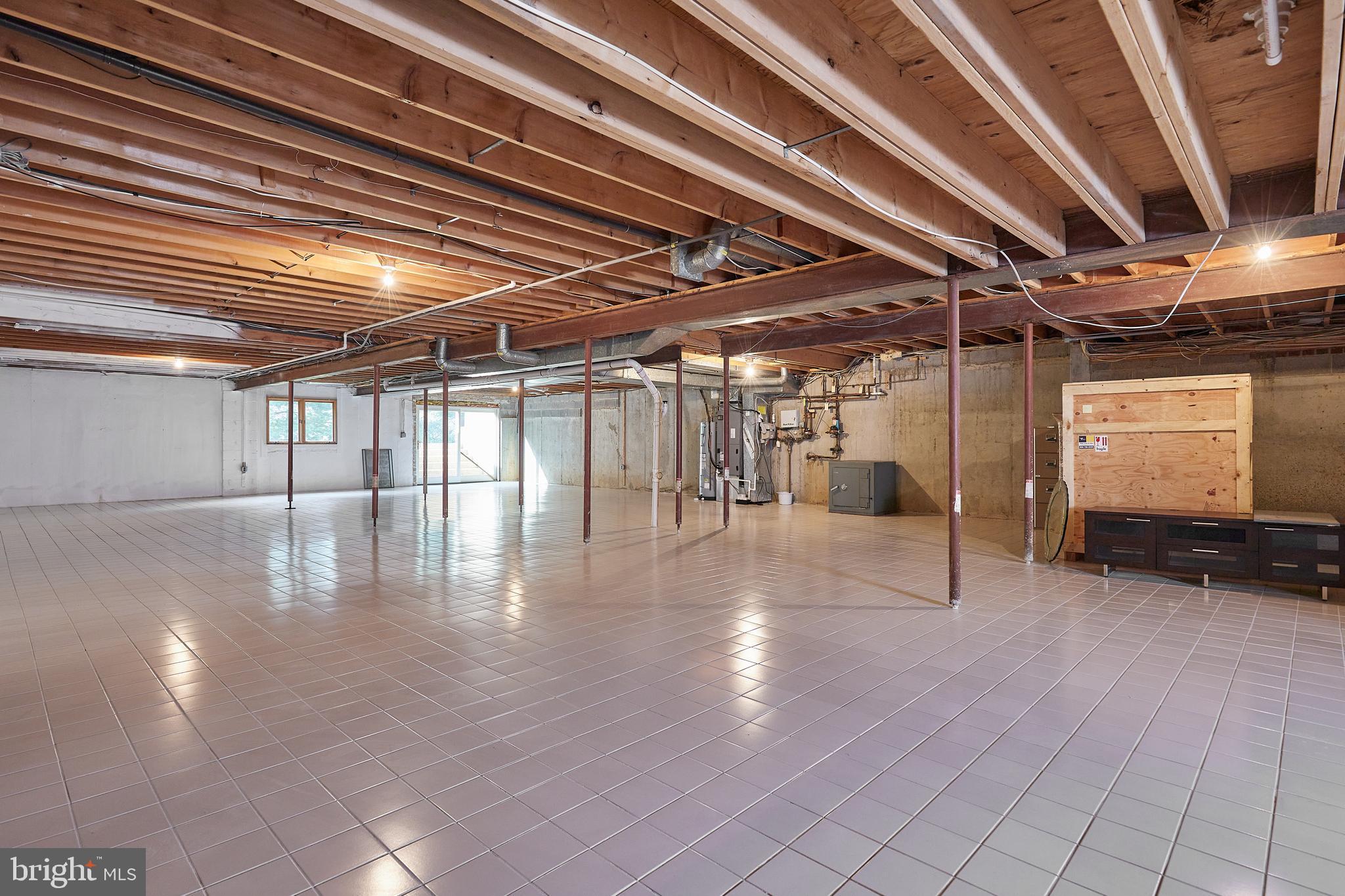 10811 Barn Wood Lane Potomac, MD 20854 - Photo 32 of 41 Unfinished Lower Level, Tile Floor & Walk-Up