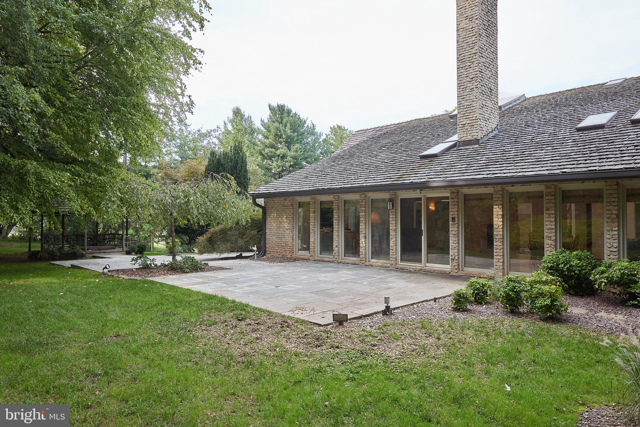 10811 Barn Wood Lane Potomac, MD 20854 - Photo 35 of 41 Rear Exterior with Walls of Windows