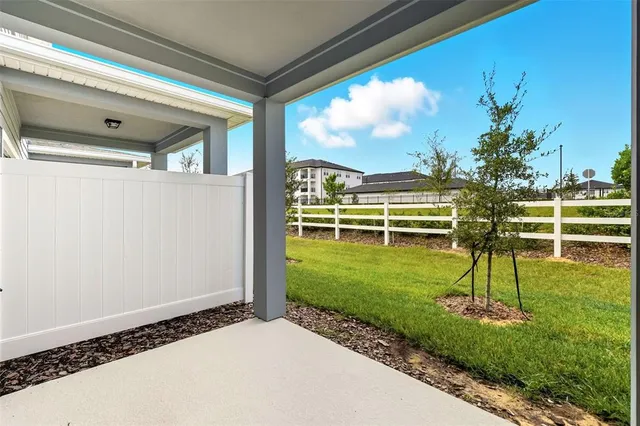 a view of house with a big yard