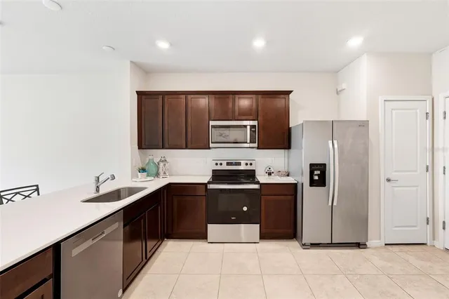 a kitchen with granite countertop a sink and cabinets