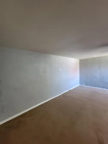 a bathroom with a toilet and bathtub