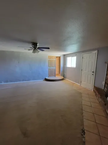 a kitchen with a sink and white cabinets