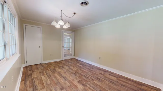 a kitchen with granite countertop cabinets and window