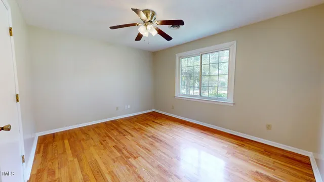 a view of a room with wooden floor