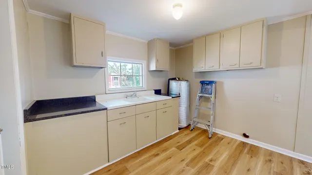 a view of backyard of house with green space