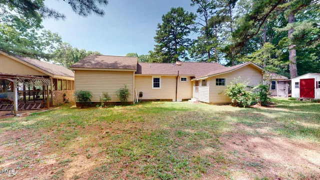 a front view of a house with a yard and porch