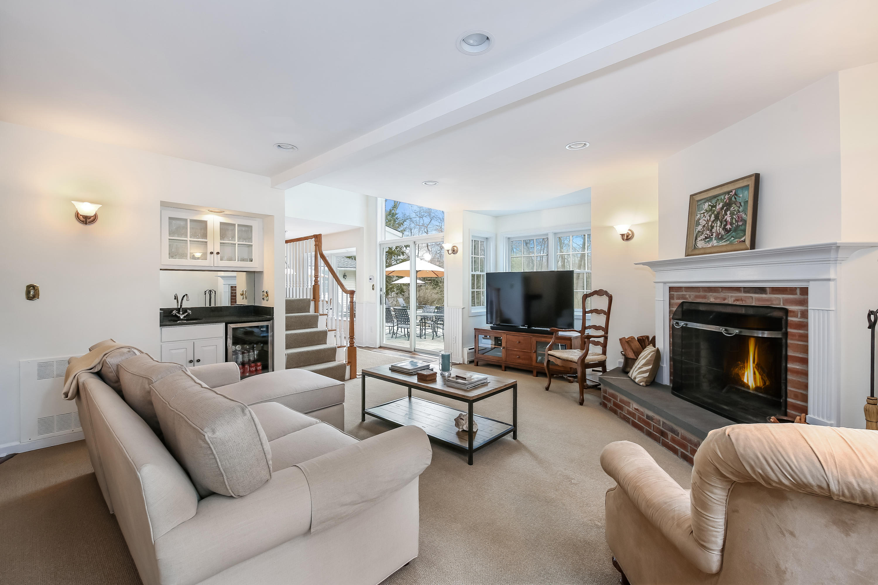 2 4 Acres Road Darien, CT 06820 - Photo 12 of 26 a living room with furniture and a fireplace