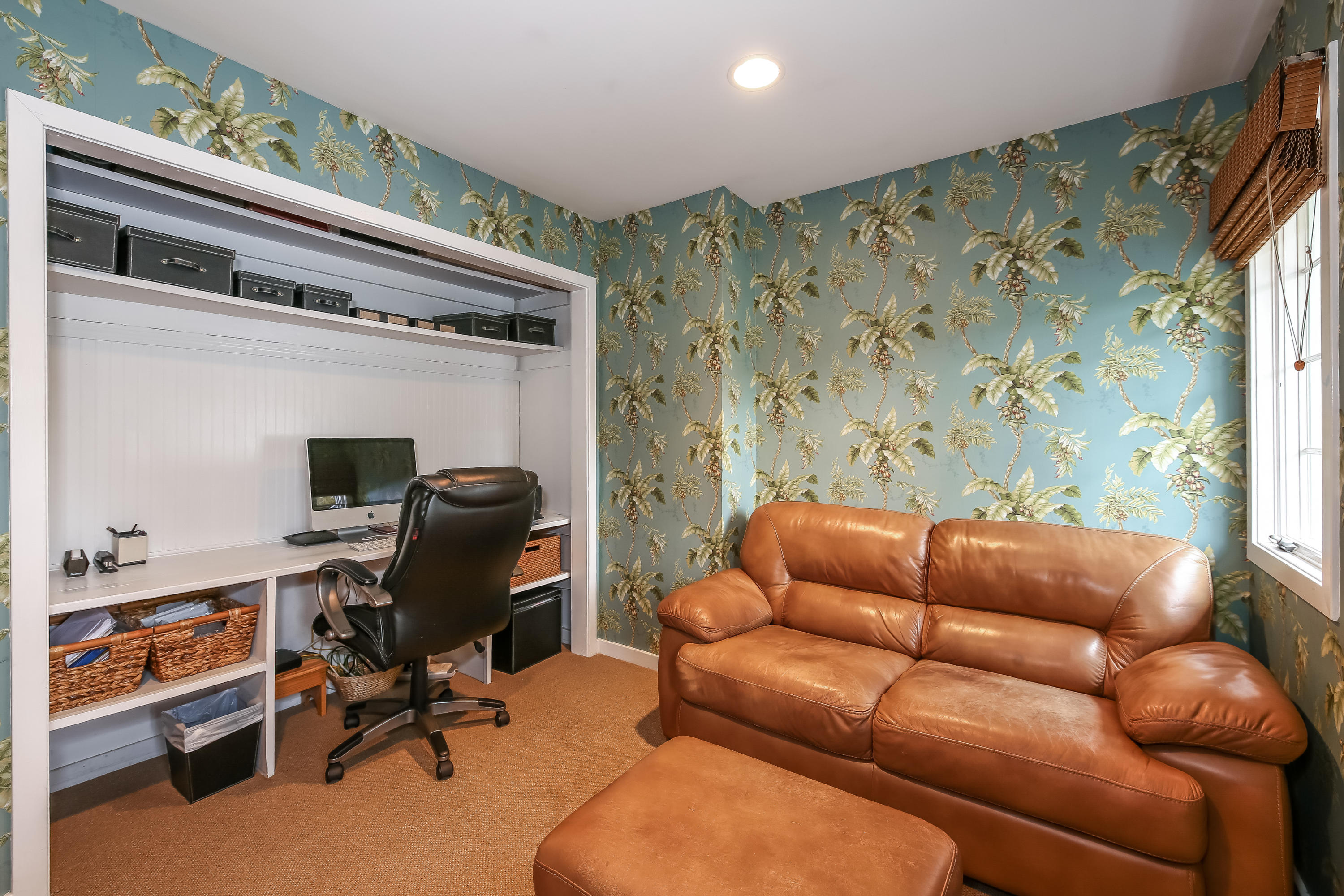 2 4 Acres Road Darien, CT 06820 - Photo 16 of 26 a livingroom with workspace and a couch