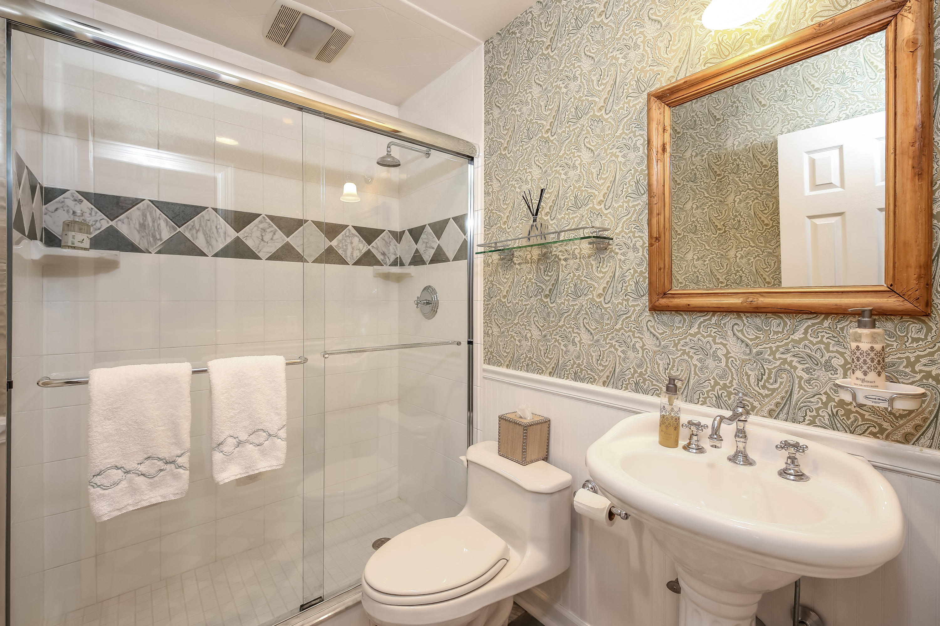 2 4 Acres Road Darien, CT 06820 - Photo 17 of 26 a bathroom with a sink toilet and shower