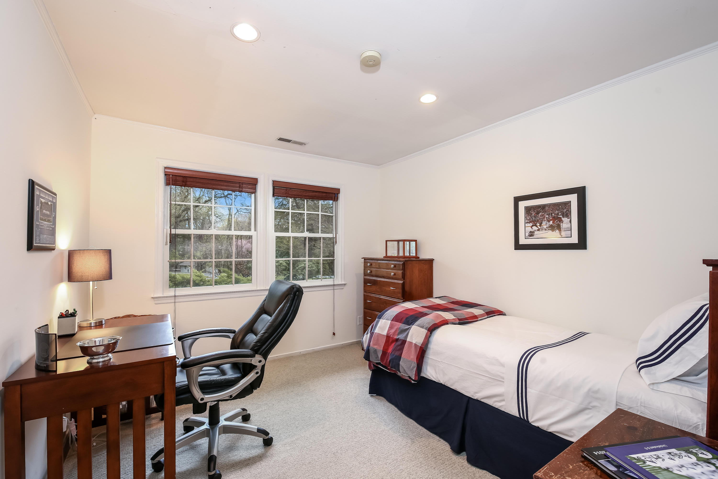 2 4 Acres Road Darien, CT 06820 - Photo 23 of 26 a bedroom with a bed a large window and a potted plant on a dresser