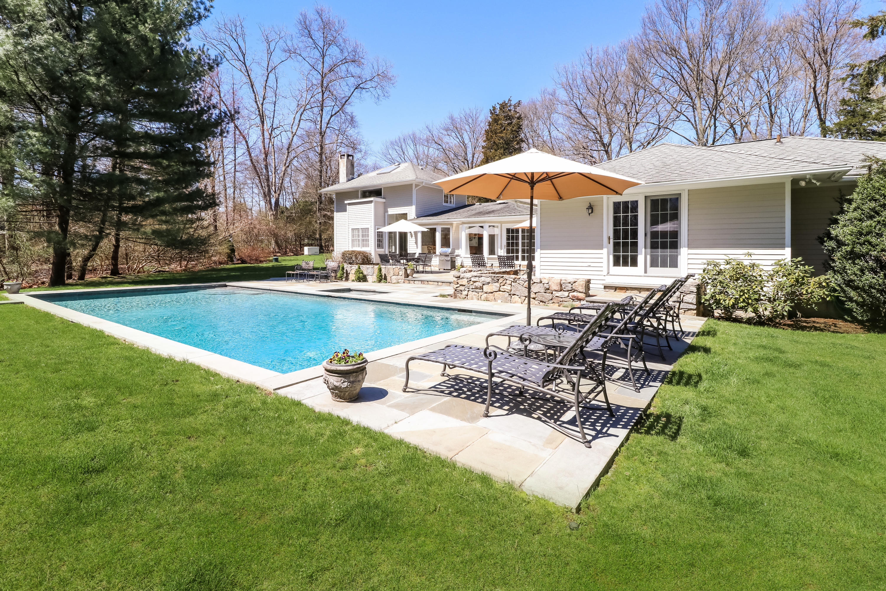 2 4 Acres Road Darien, CT 06820 - Photo 4 of 26 a view of a house with swimming pool and sitting area
