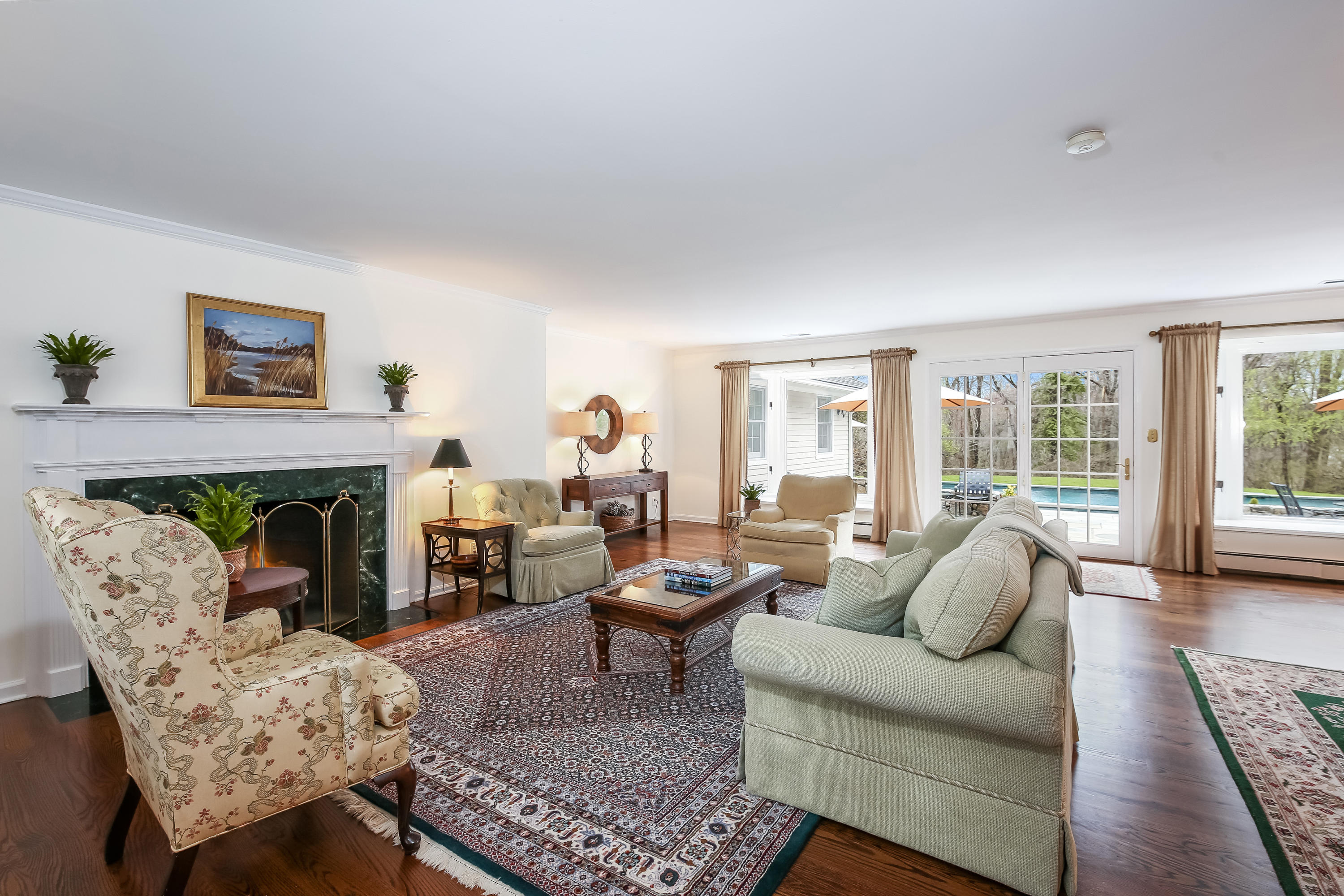 2 4 Acres Road Darien, CT 06820 - Photo 6 of 26 a living room with furniture and a fireplace