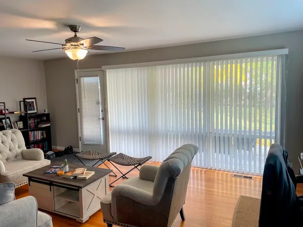 a living room with furniture and a window
