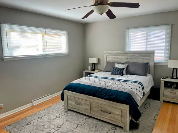 a bedroom with a bed and a window