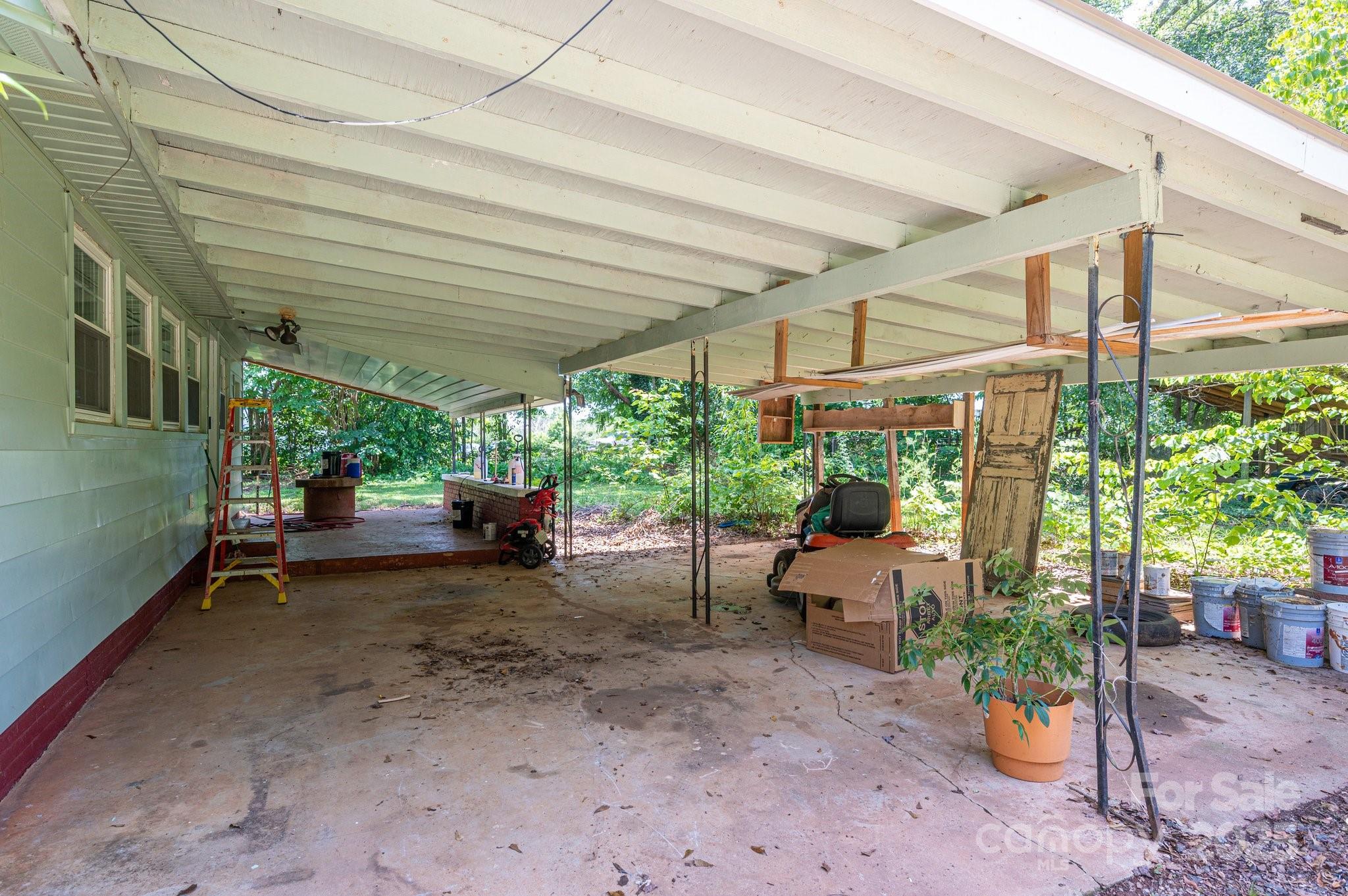 1173 Cat Square Road Vale, NC 28168 - Photo 27 of 33 a view of a patio with a table and chairs and potted plants