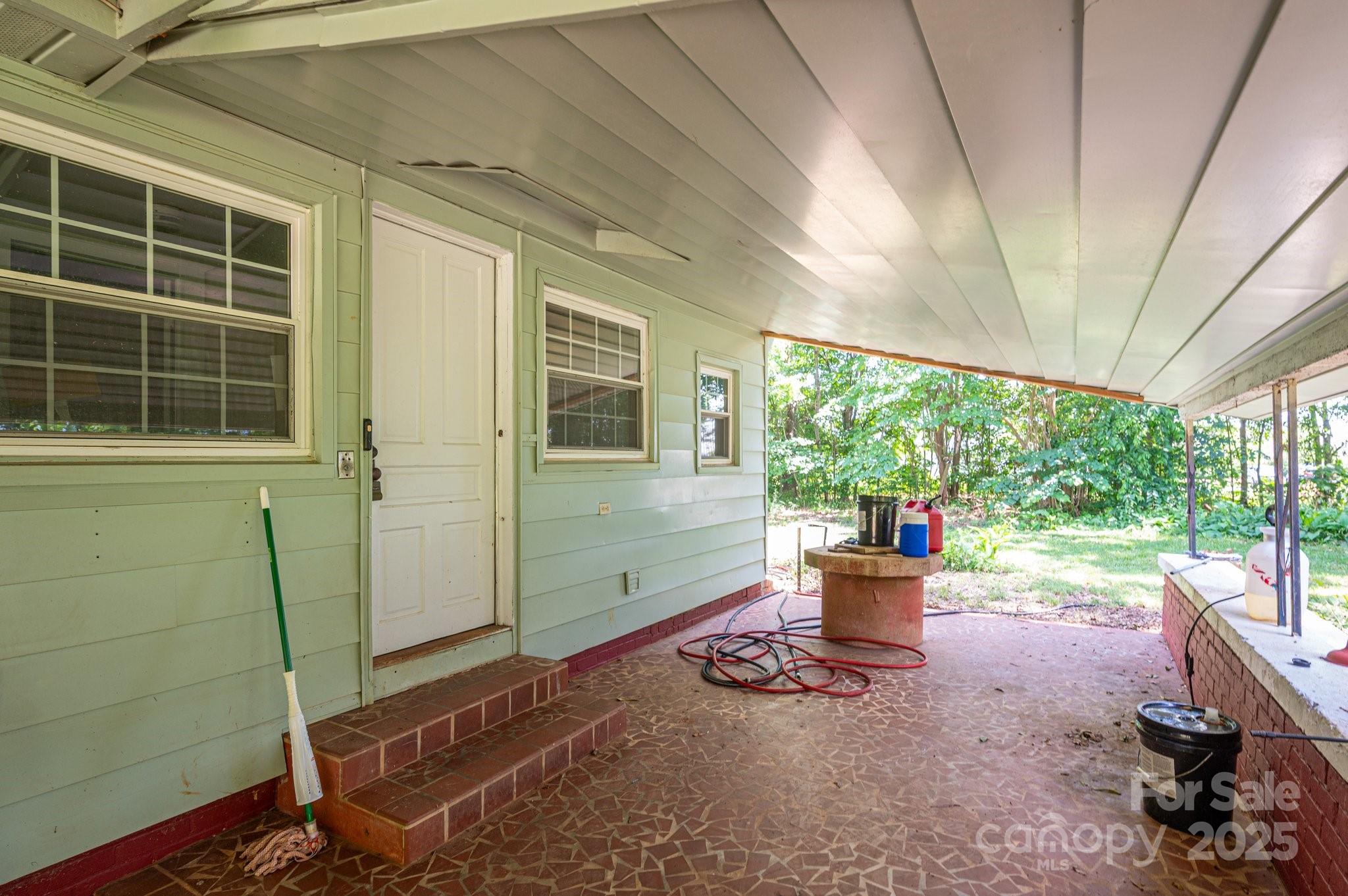 1173 Cat Square Road Vale, NC 28168 - Photo 28 of 33 a backyard of a house with wooden floor and outdoor seating