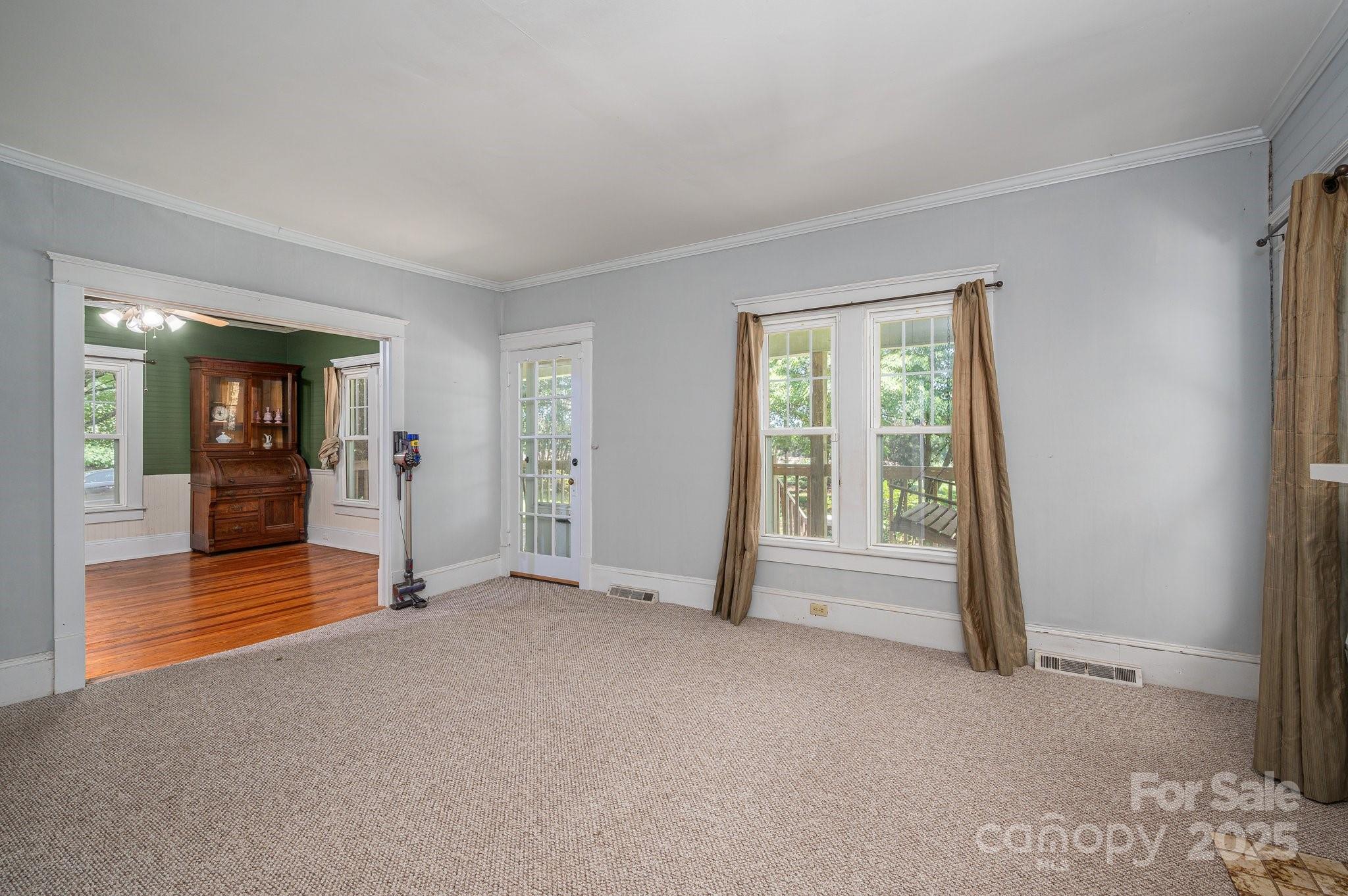 1173 Cat Square Road Vale, NC 28168 - Photo 6 of 33 a view of empty room with wooden floor and windows