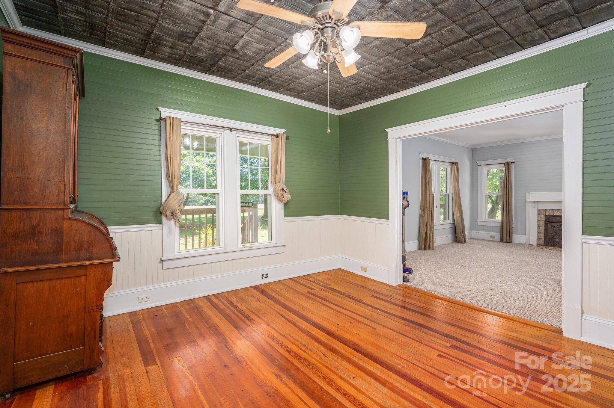 1173 Cat Square Road Vale, NC 28168 - Photo 8 of 33 a view of an empty room with wooden floor and a window