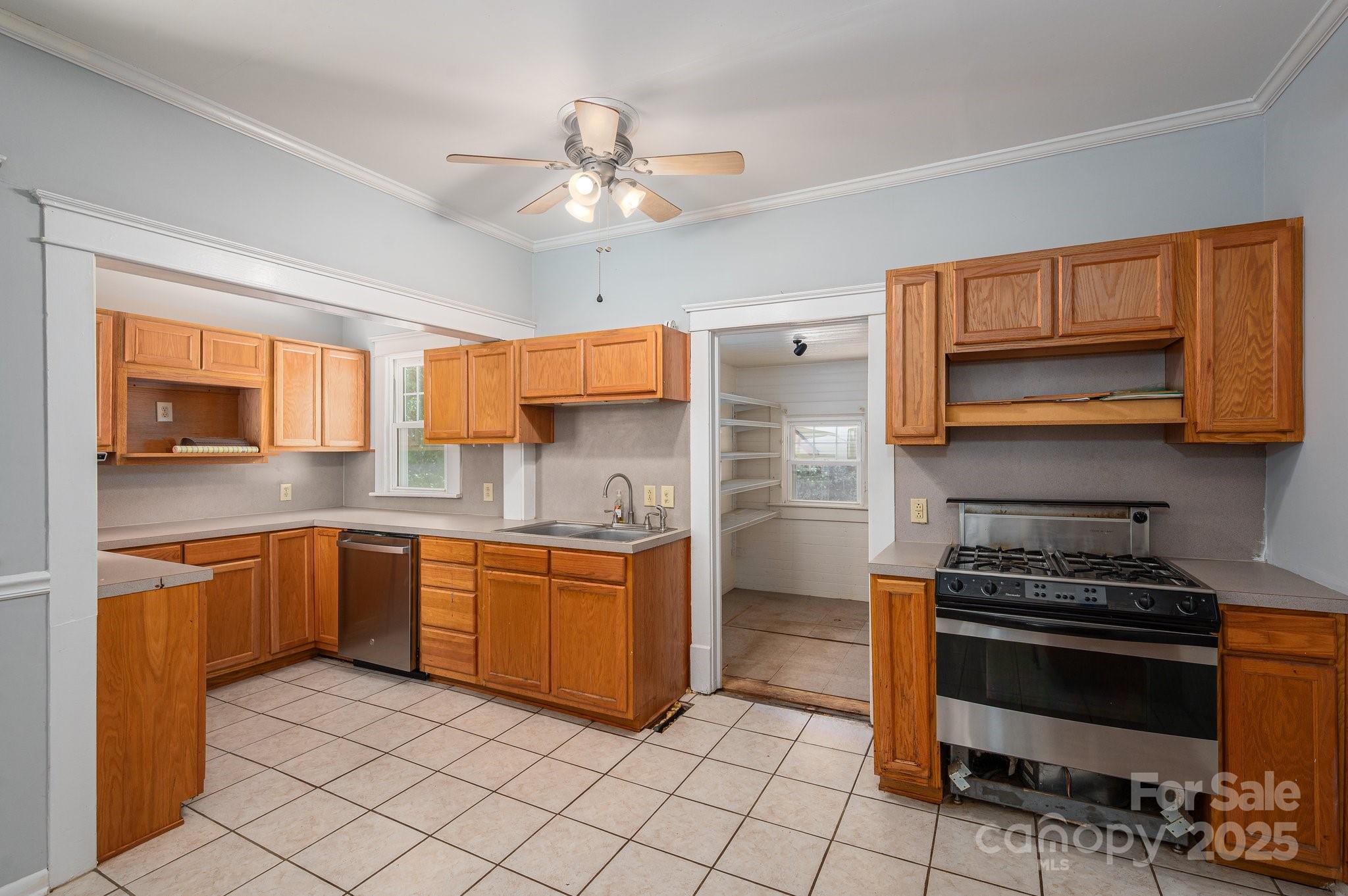 1173 Cat Square Road Vale, NC 28168 - Photo 10 of 33 a kitchen with stainless steel appliances a stove sink and cabinets