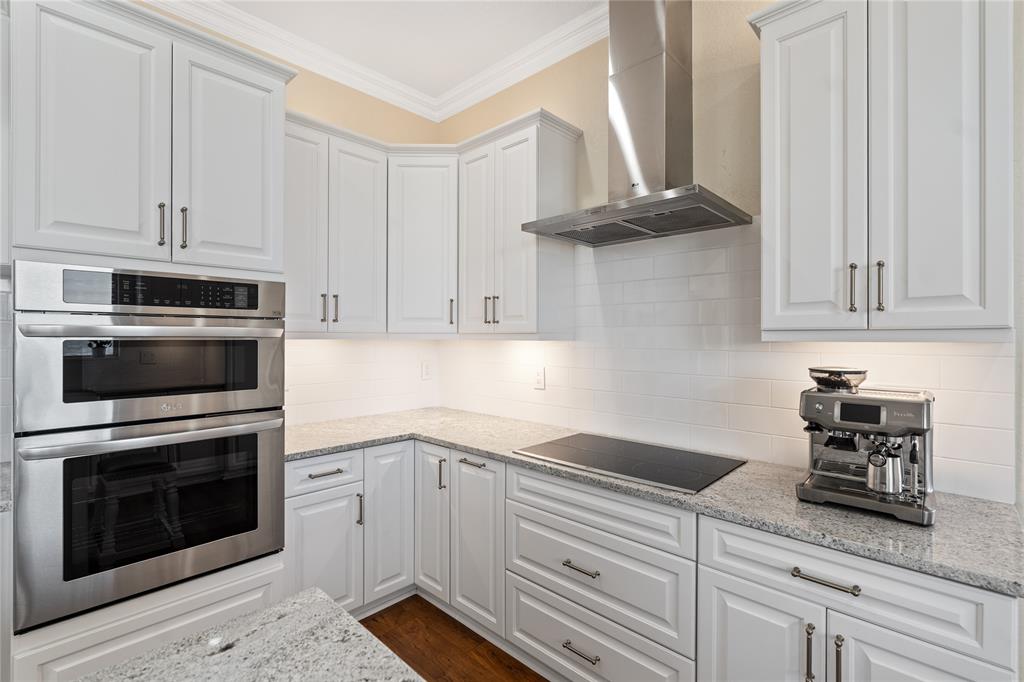 19239 Southwest 54th Street Miramar, FL 33029 - Photo 22 of 82 a kitchen with granite countertop white cabinets and stainless steel appliances