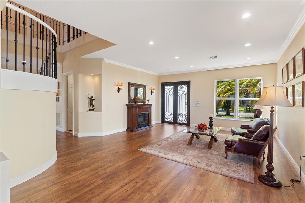 19239 Southwest 54th Street Miramar, FL 33029 - Photo 31 of 82 a living room with furniture and a wooden floor