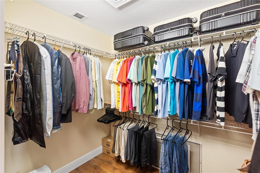 19239 Southwest 54th Street Miramar, FL 33029 - Photo 49 of 82 a view of walk in closet with clothes and shoes