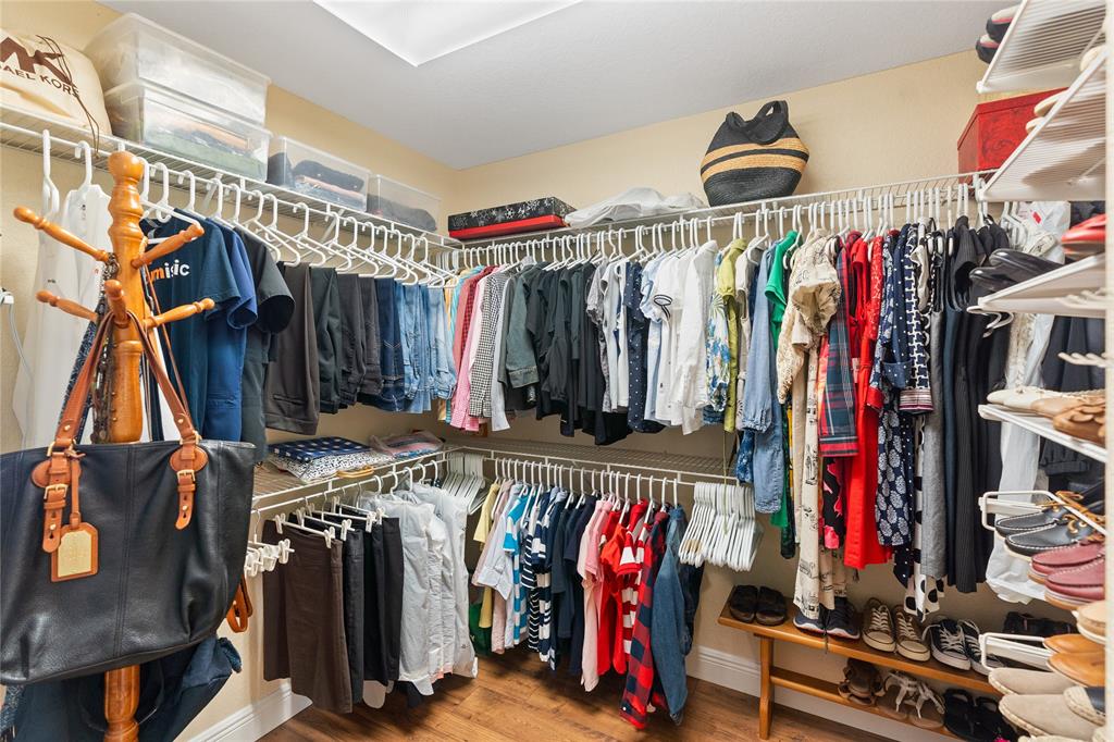 19239 Southwest 54th Street Miramar, FL 33029 - Photo 50 of 82 a view of walk in closet with clothes