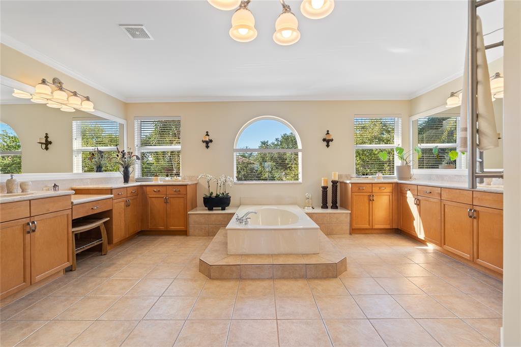 19239 Southwest 54th Street Miramar, FL 33029 - Photo 51 of 82 a large white tub sitting in a room next to a window