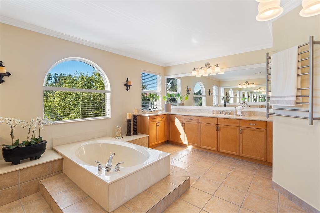 19239 Southwest 54th Street Miramar, FL 33029 - Photo 52 of 82 a spacious bathroom with a tub a sink and mirror