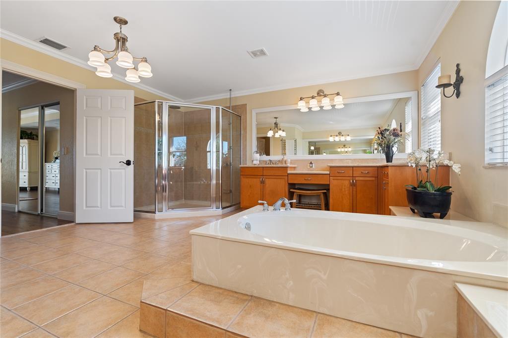 19239 Southwest 54th Street Miramar, FL 33029 - Photo 53 of 82 a large living room with a large tub and chandelier