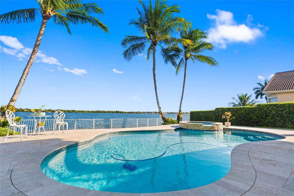 19239 Southwest 54th Street Miramar, FL 33029 - Photo 6 of 82 a view of a swimming pool with a terrace