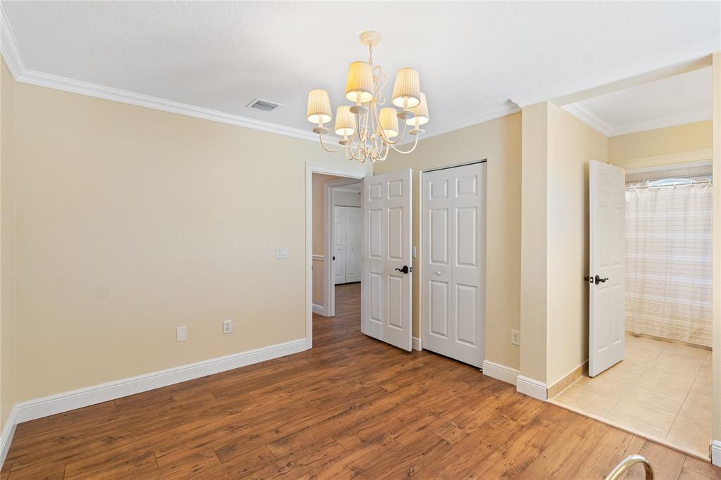 19239 Southwest 54th Street Miramar, FL 33029 - Photo 62 of 82 a view of an empty room with wooden floor and a window