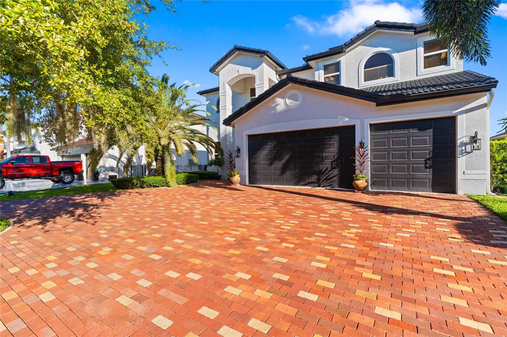 19239 Southwest 54th Street Miramar, FL 33029 - Photo 67 of 82 a front view of a house with a yard