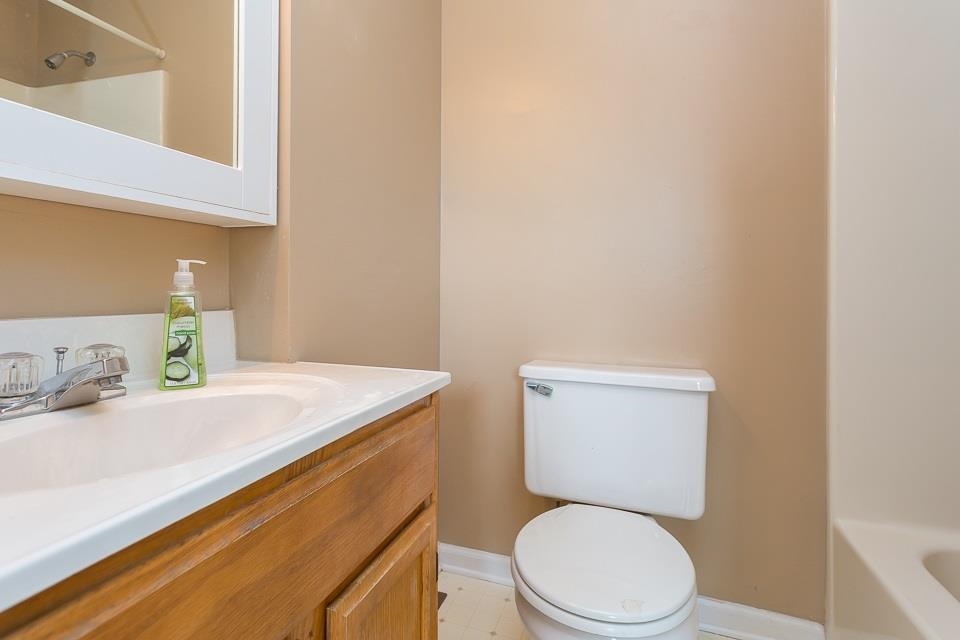 2039 Hampton Drive Waynesboro, VA 22980 - Photo 4 of 20 a bathroom with a sink a toilet and vanity
