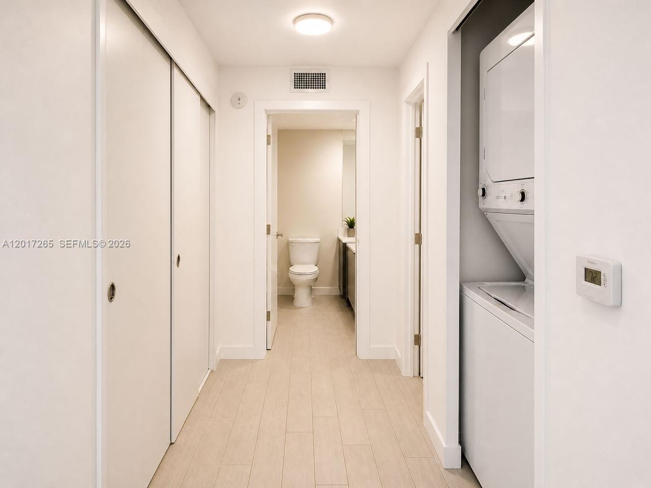 321 Northeast 26th Street, Unit 515 Miami, FL 33137 - Photo 6 of 7 a bathroom with a granite countertop shower and a sink