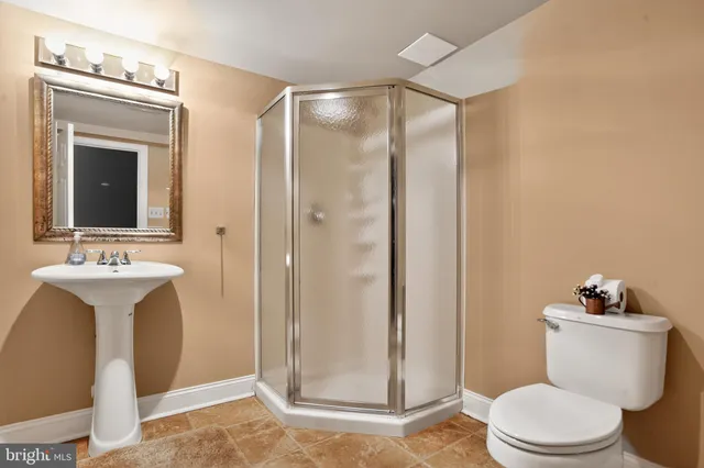 a view of a big yard with large trees