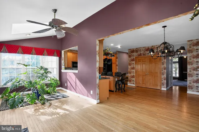 a view of a room with wooden floor