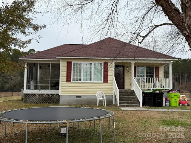 a front view of a house with seating space