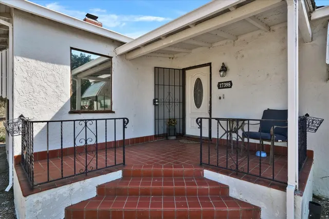 an aerial view of a house with lake view