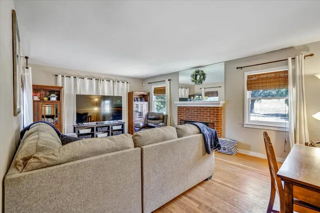 an aerial view of a house with a yard and sitting space