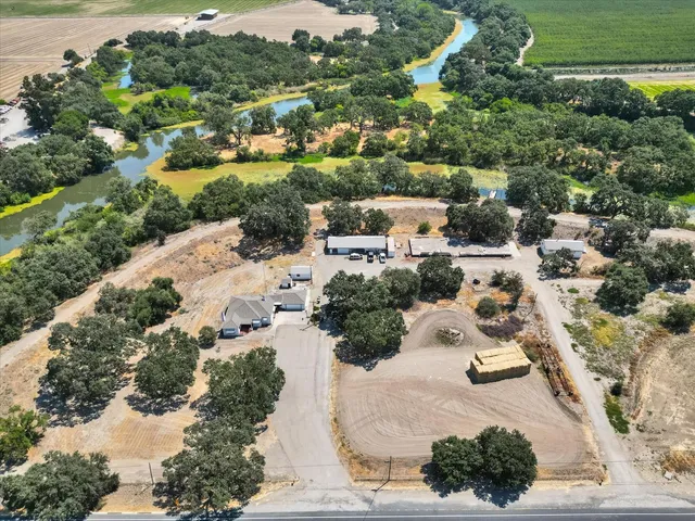 a view of a dining room with furniture wooden floor and chandelier