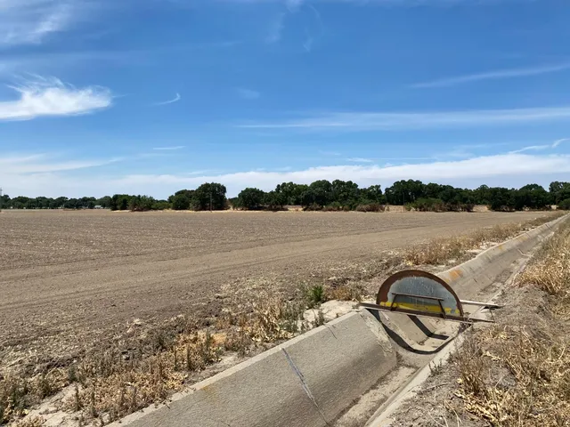 a view of an ocean beach and city
