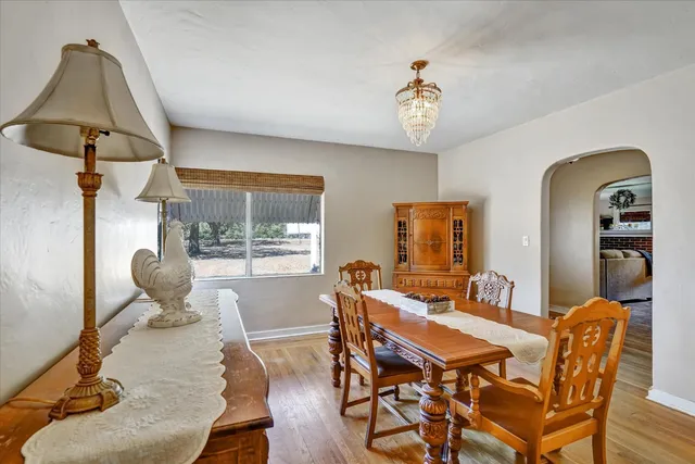 a bedroom with a bed and a flat tv screen on dresser