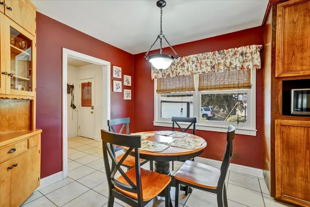 a bedroom with a bed and a flat tv screen on the dresser