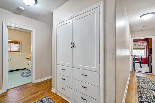 a view of a house with wooden fence